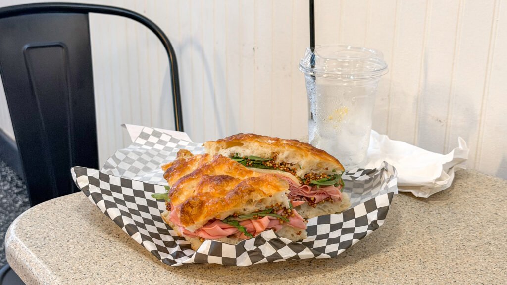 Taylor's Delicatessen Stratford | Krista the Explorer Focaccia sandwich loaded with mortadella and fresh vegetables.