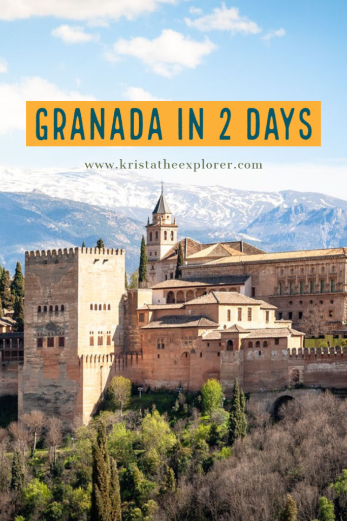 View of Alhambra with mountains in background.