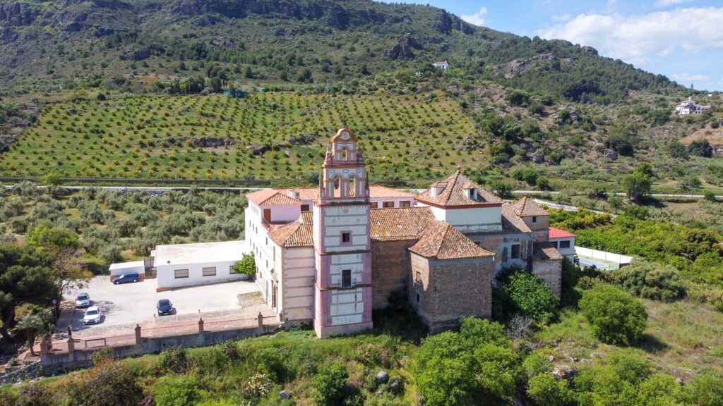 Aerial view of large church in countryside. 