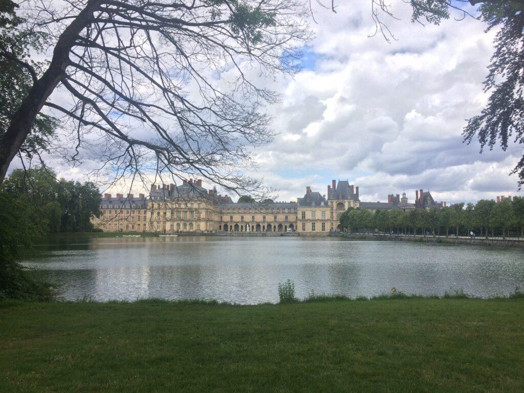 Fontainebleau France | Krista the Explorer View of Fontainebleau Palace from across a small lake.
