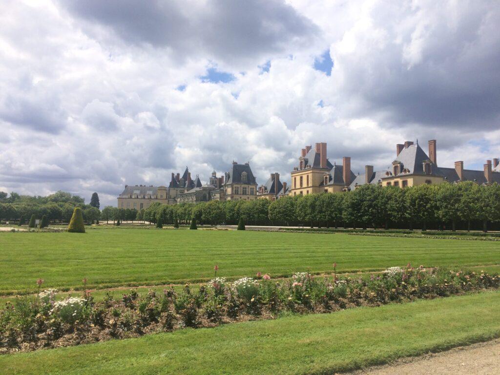 Fontainebleau France | Krista the Explorer View of the Palace of Fontainebleau across the grass.