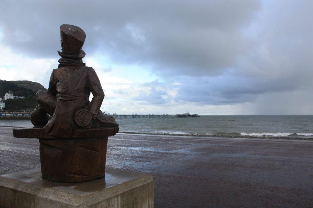 Mad Hatter Statue along coast in Wales.