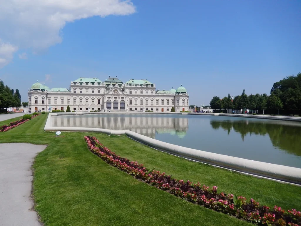 Royal palace in Vienna with gardens in front.