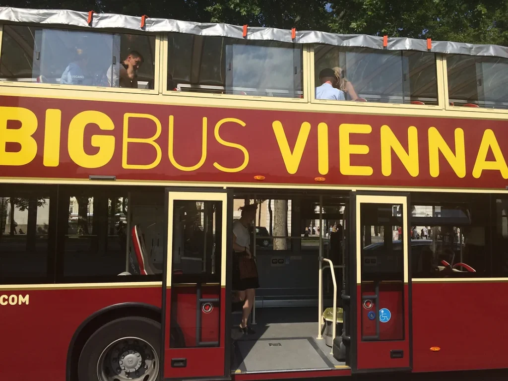 Red open top bus in Vienna for tours.