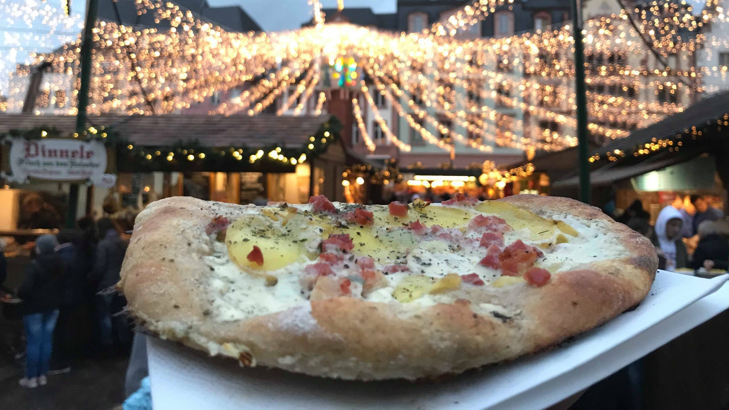 Pizza-shaped bread with cream on top.