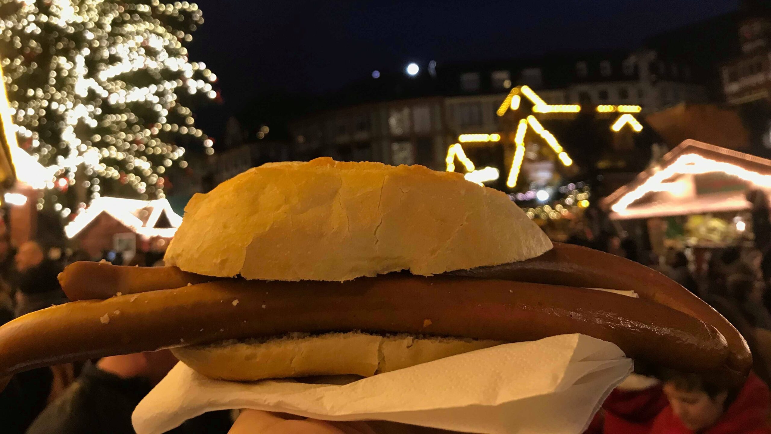 Long sausage on bun at Christmas market.