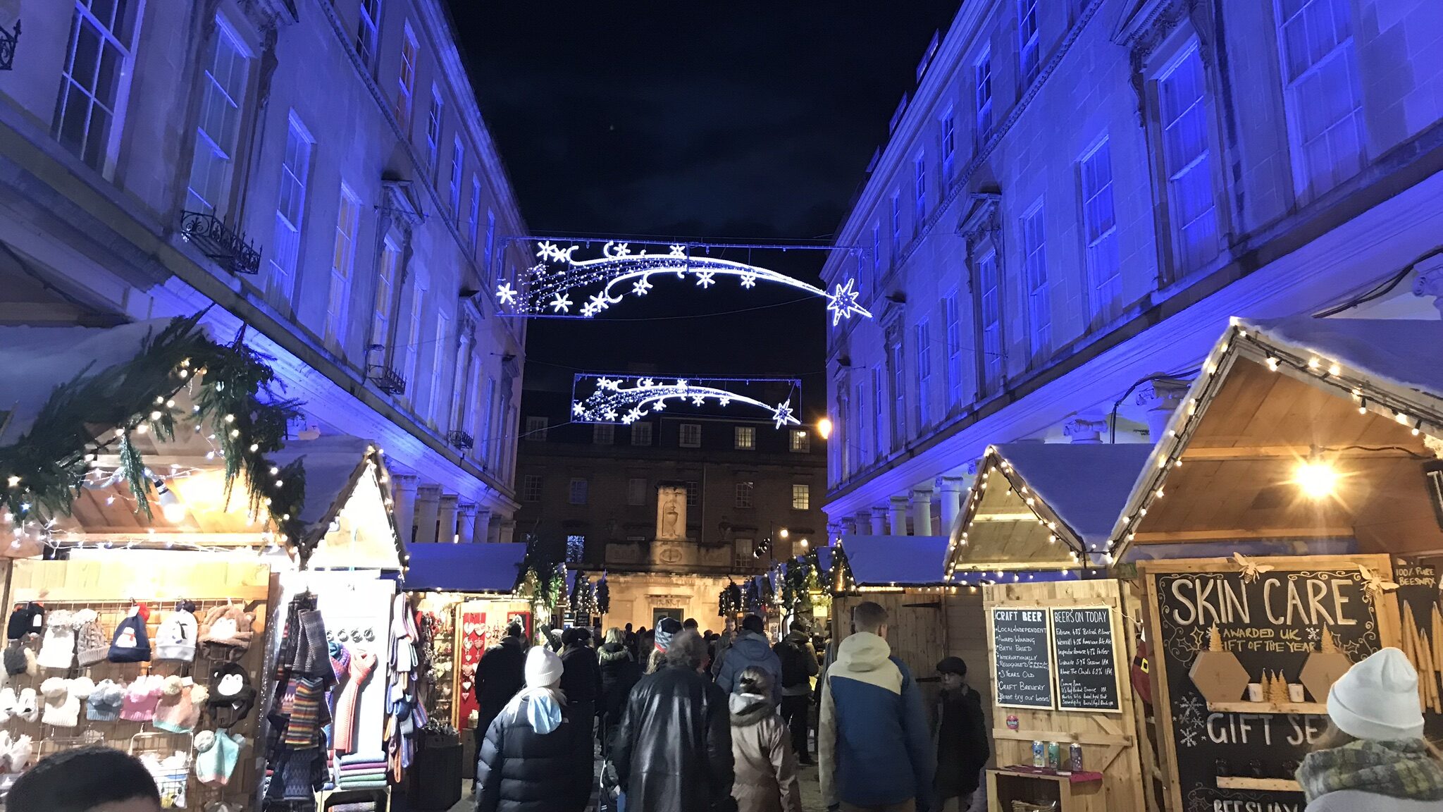 Street in Bath with market stalls for Christmas.