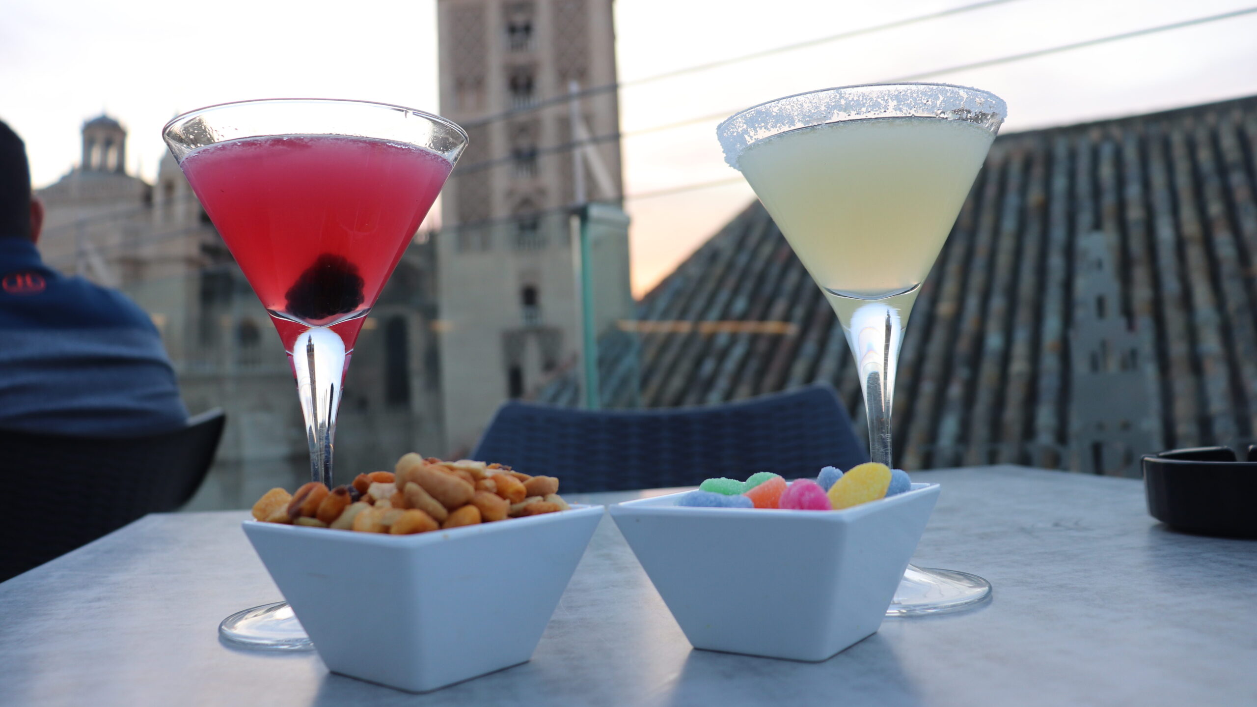 Two cocktails with cathedral in background.