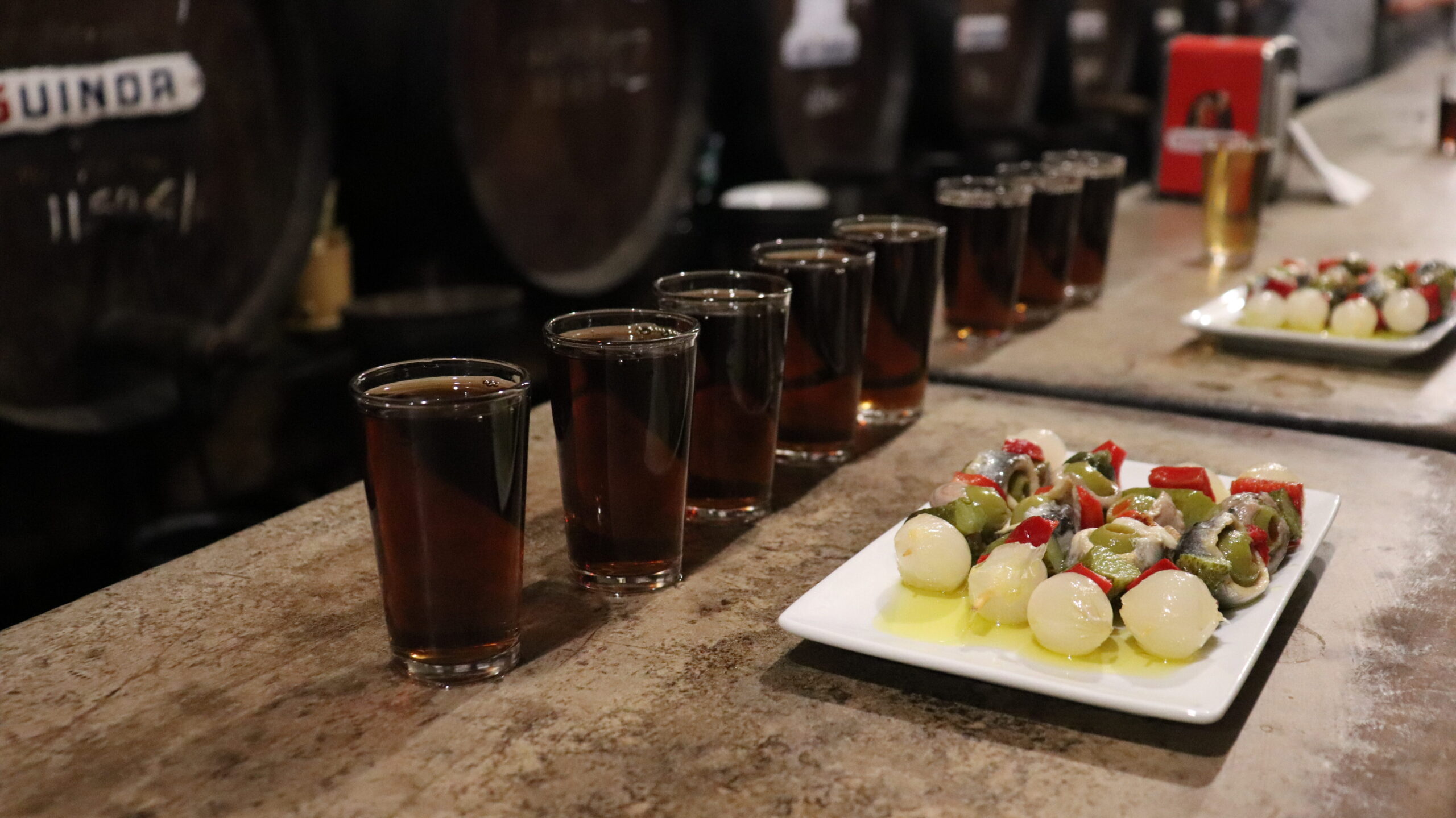 Wine and tapas in old bar in Malaga.