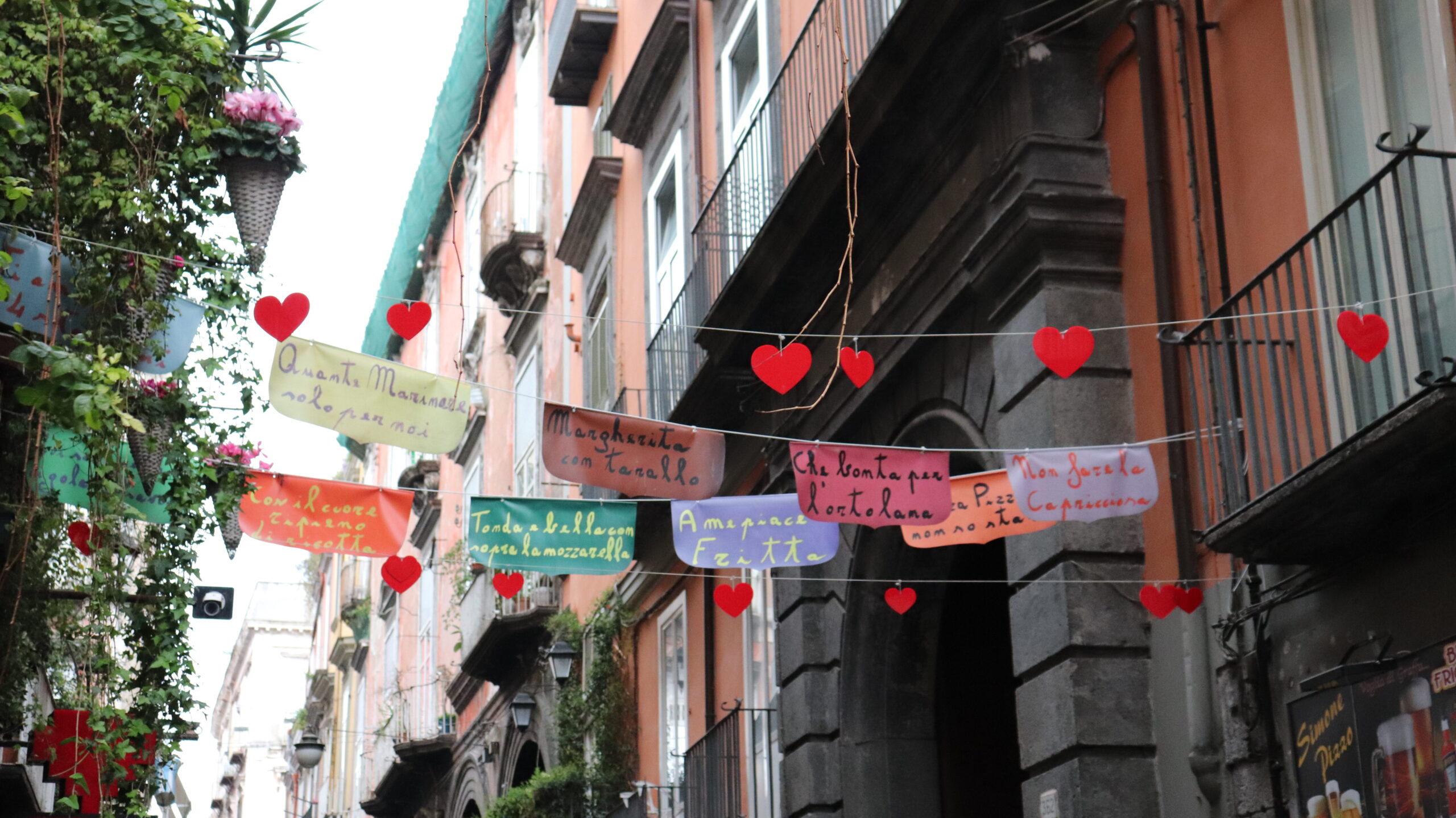 Street in Naples decorated with flags.