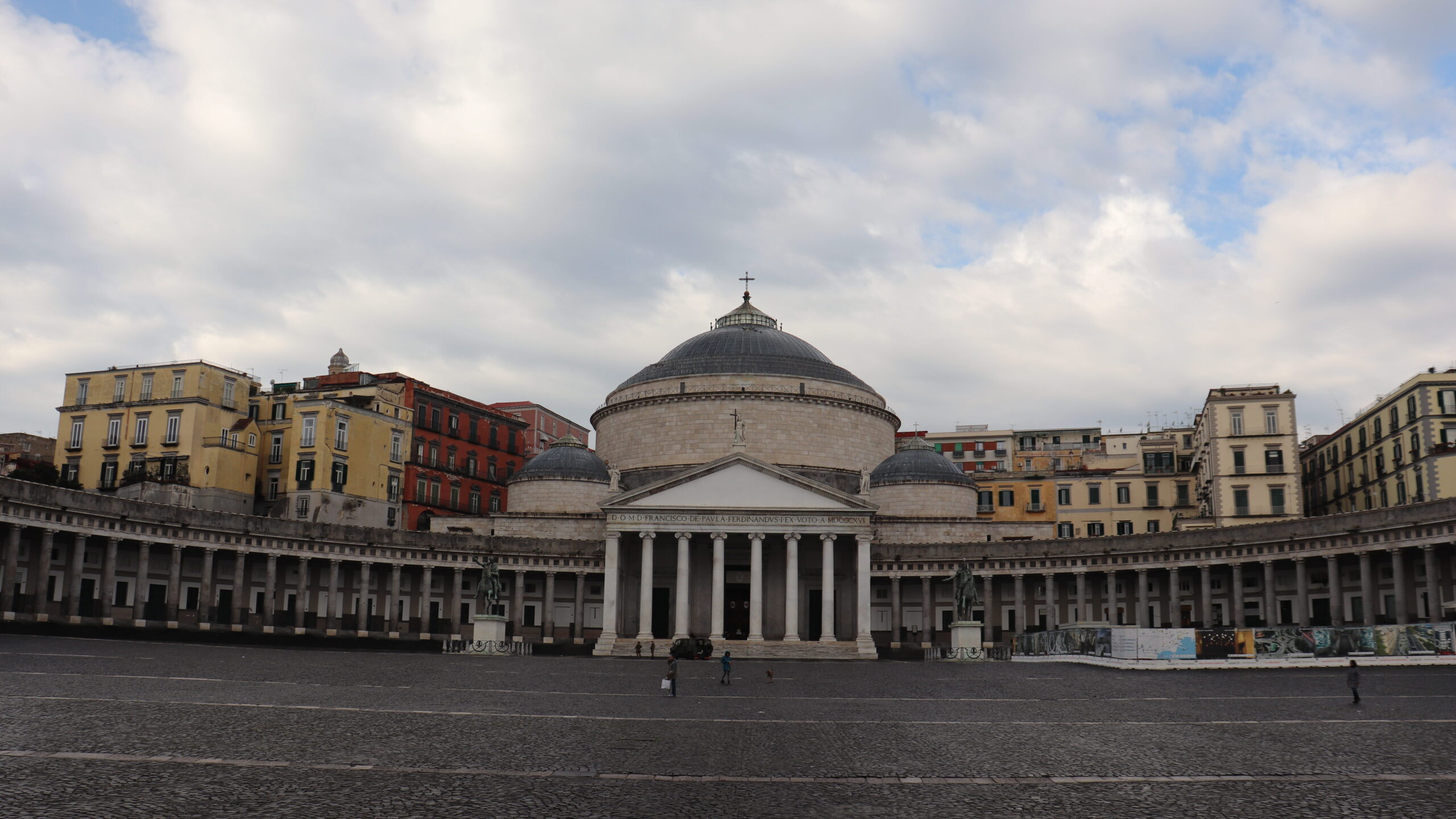 Main piazza in Naples with domed building.