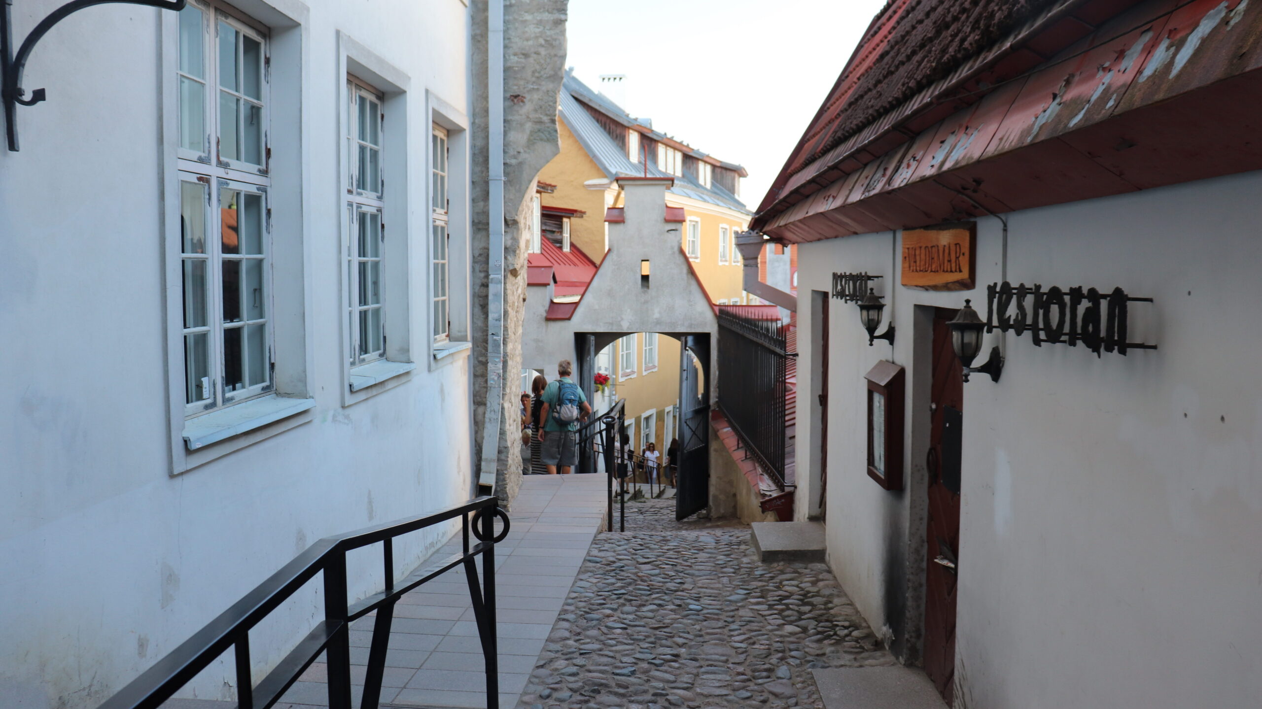 Historic street in Tallinn with colourful houses.