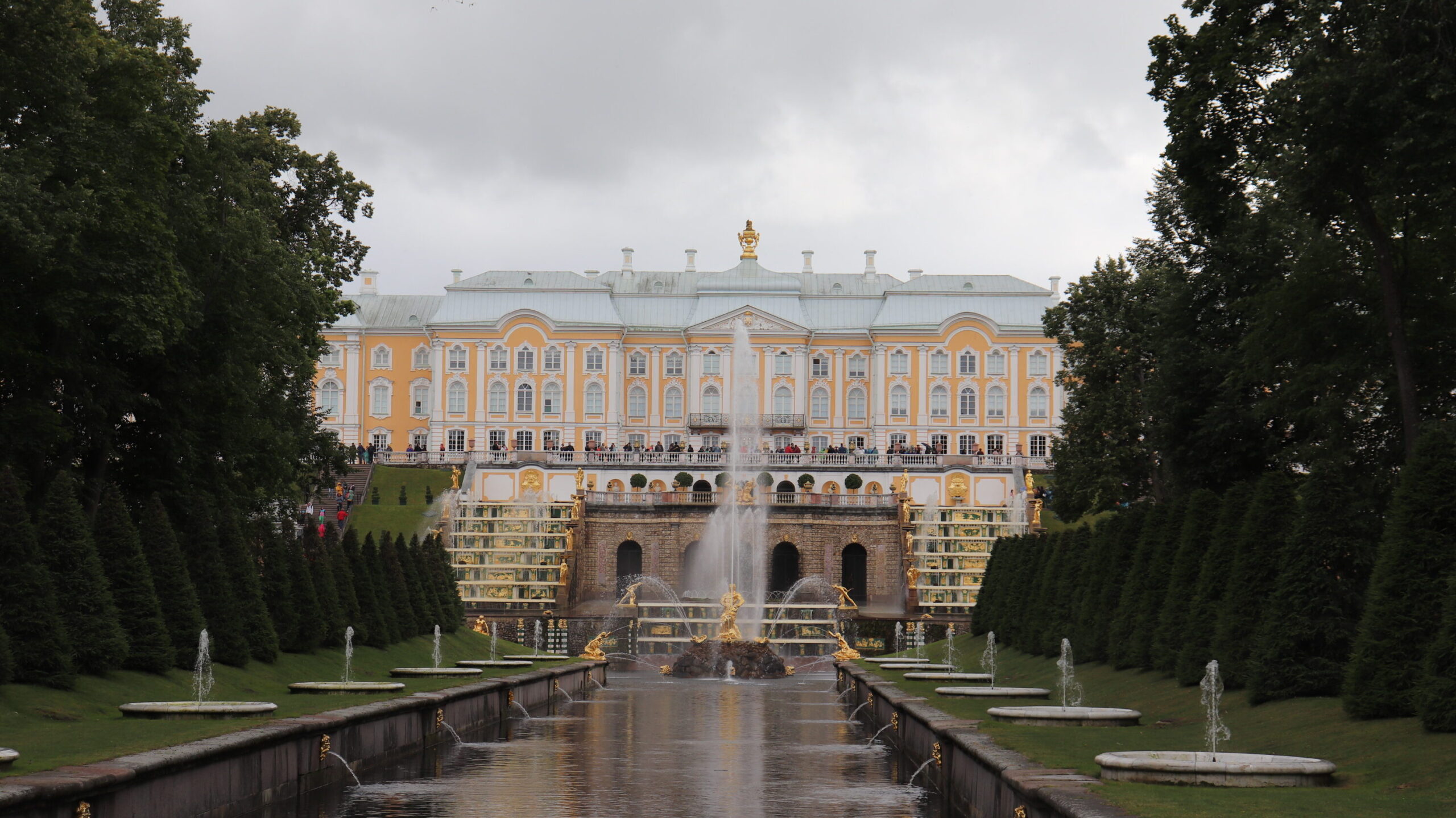 View of grand palace with water feature.