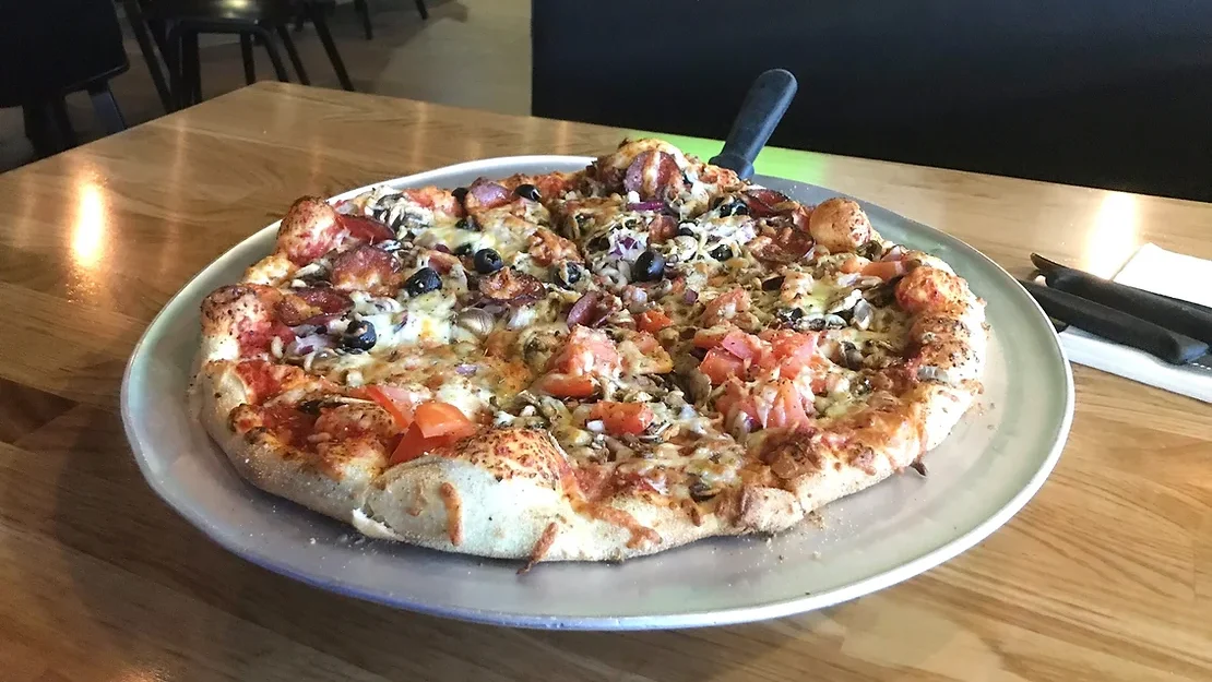 Medium sized pizza in restaurant in Iceland.