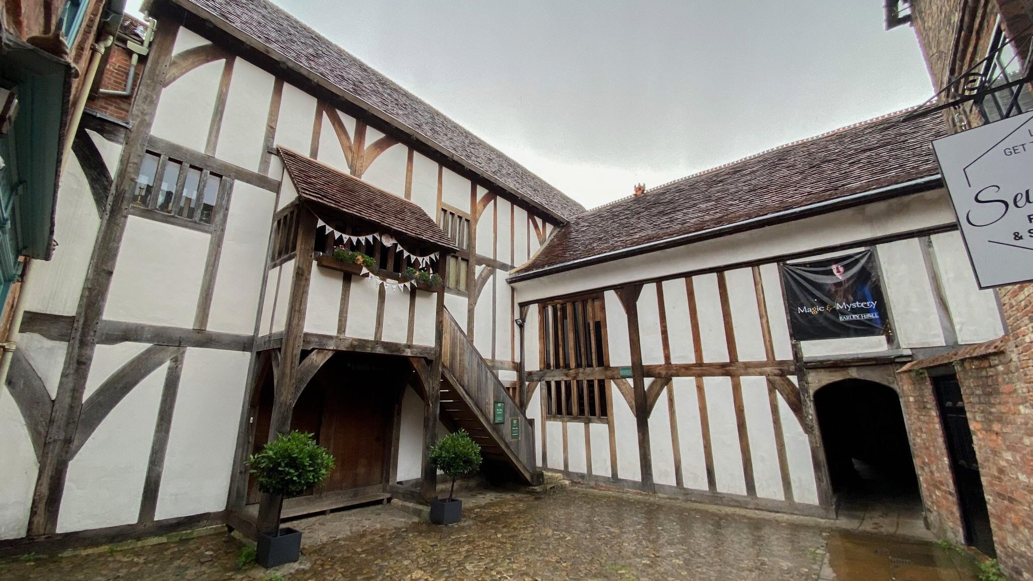 Small courtyard among medieval buildings.