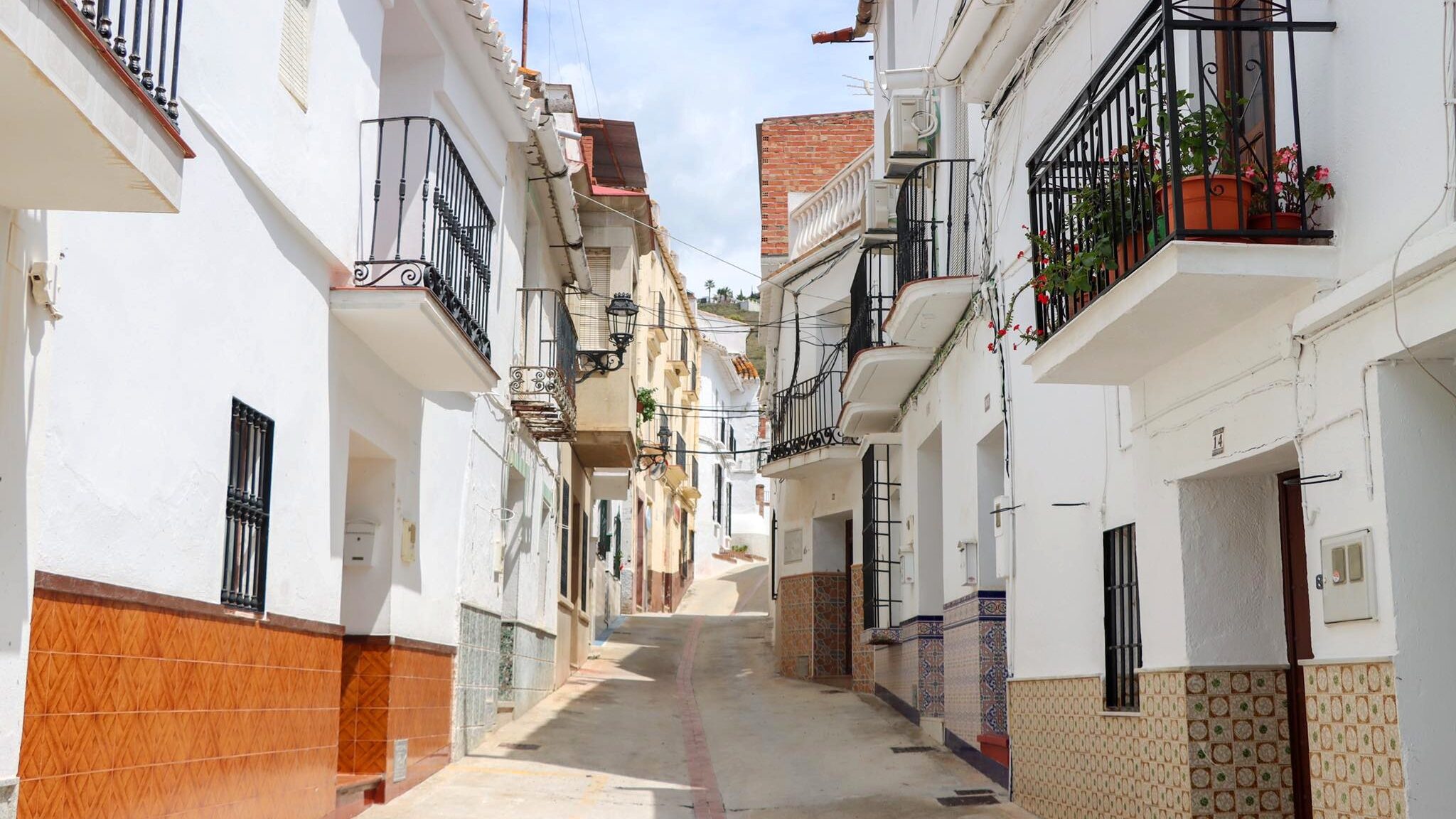 Whitewashed street in the village of Benamargosa.