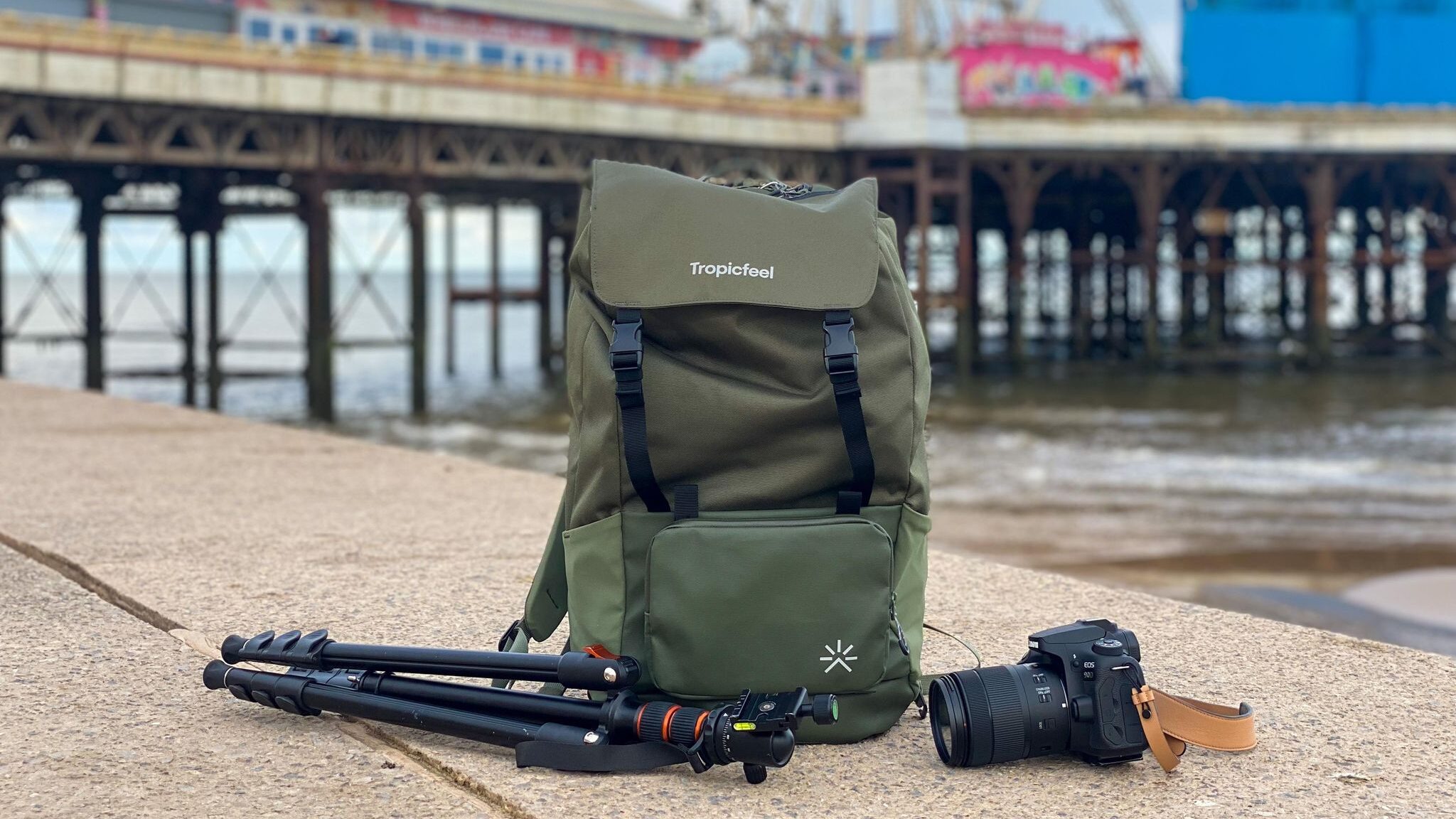 Tropicfeel backpack in front of pier.