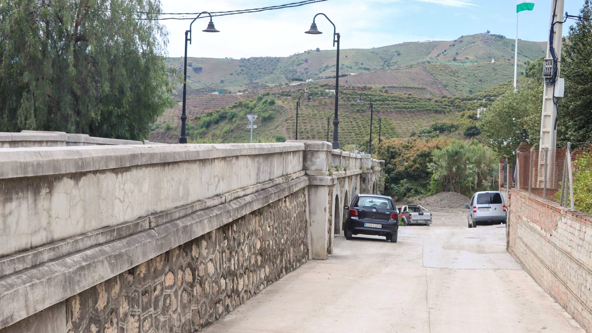 Small stone bridge in white village.