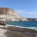 Rocky beach with high cliffs in Almeria.