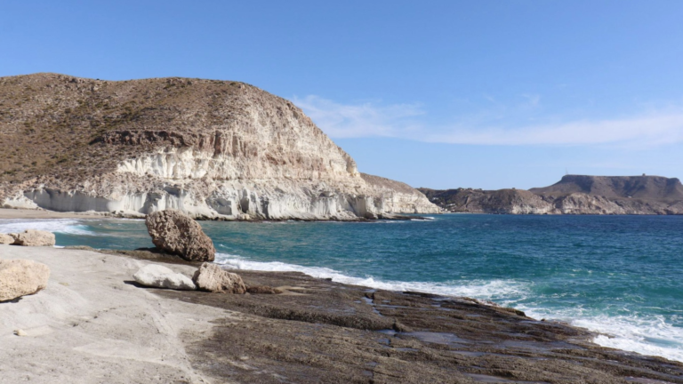 Rocky beach with high cliffs in Almeria.