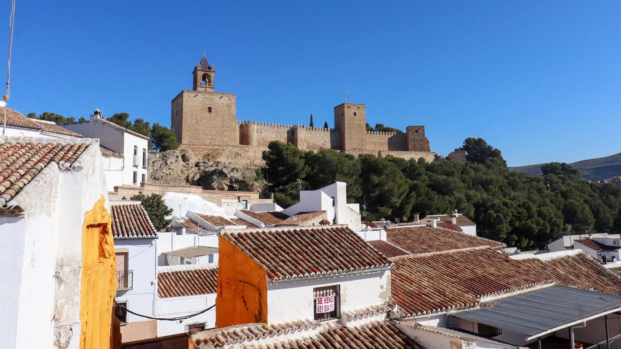 Castle on a hill in white town.