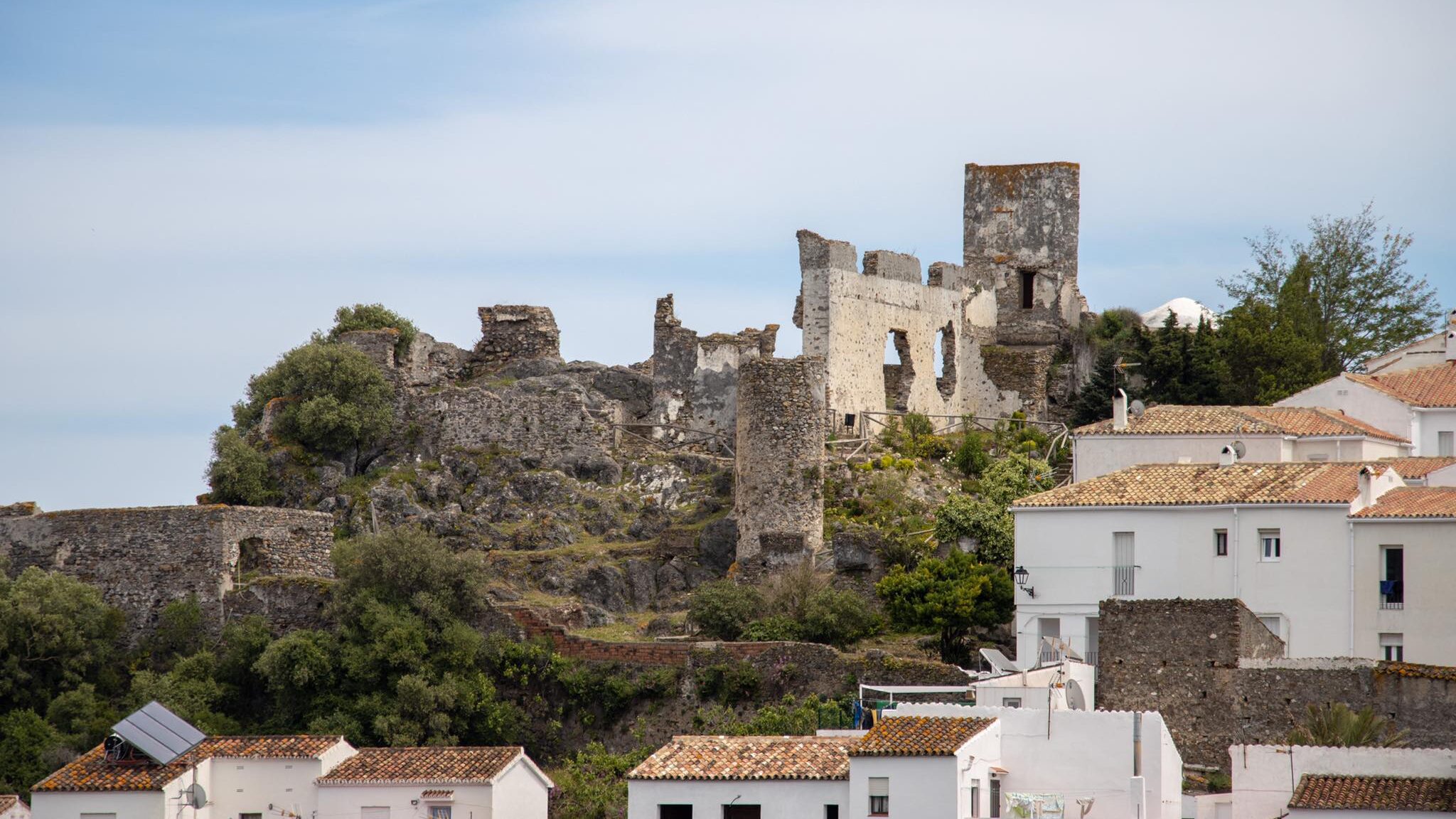 Ruins of medieval castle on a hill.