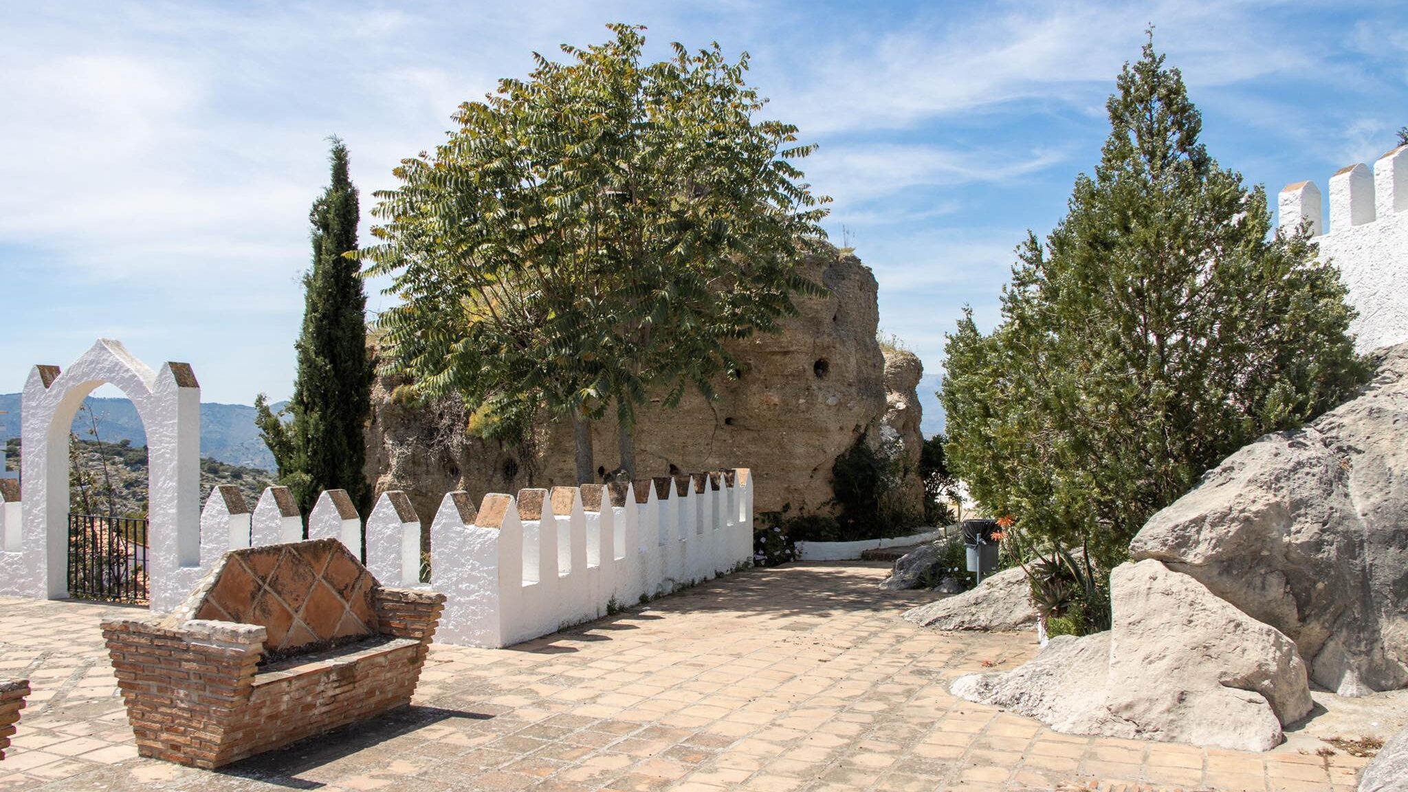 Ruins of castle at the top of a white village.