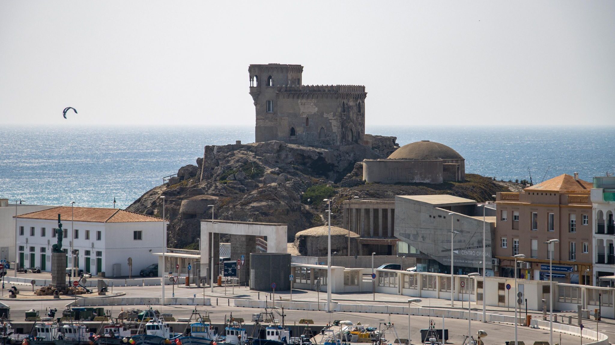 Medieval castle on a hill overlooking sea.