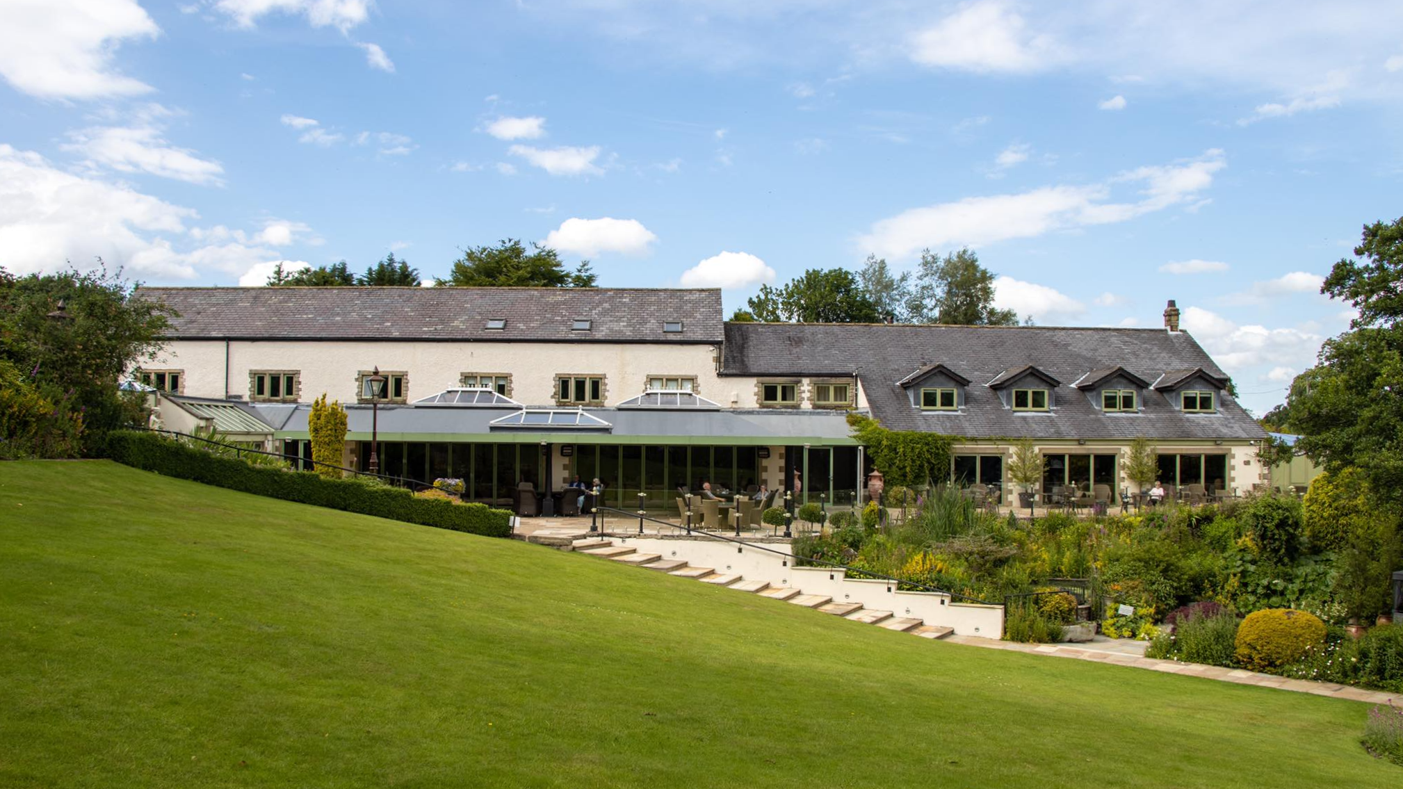 View of country hotel from gardens.