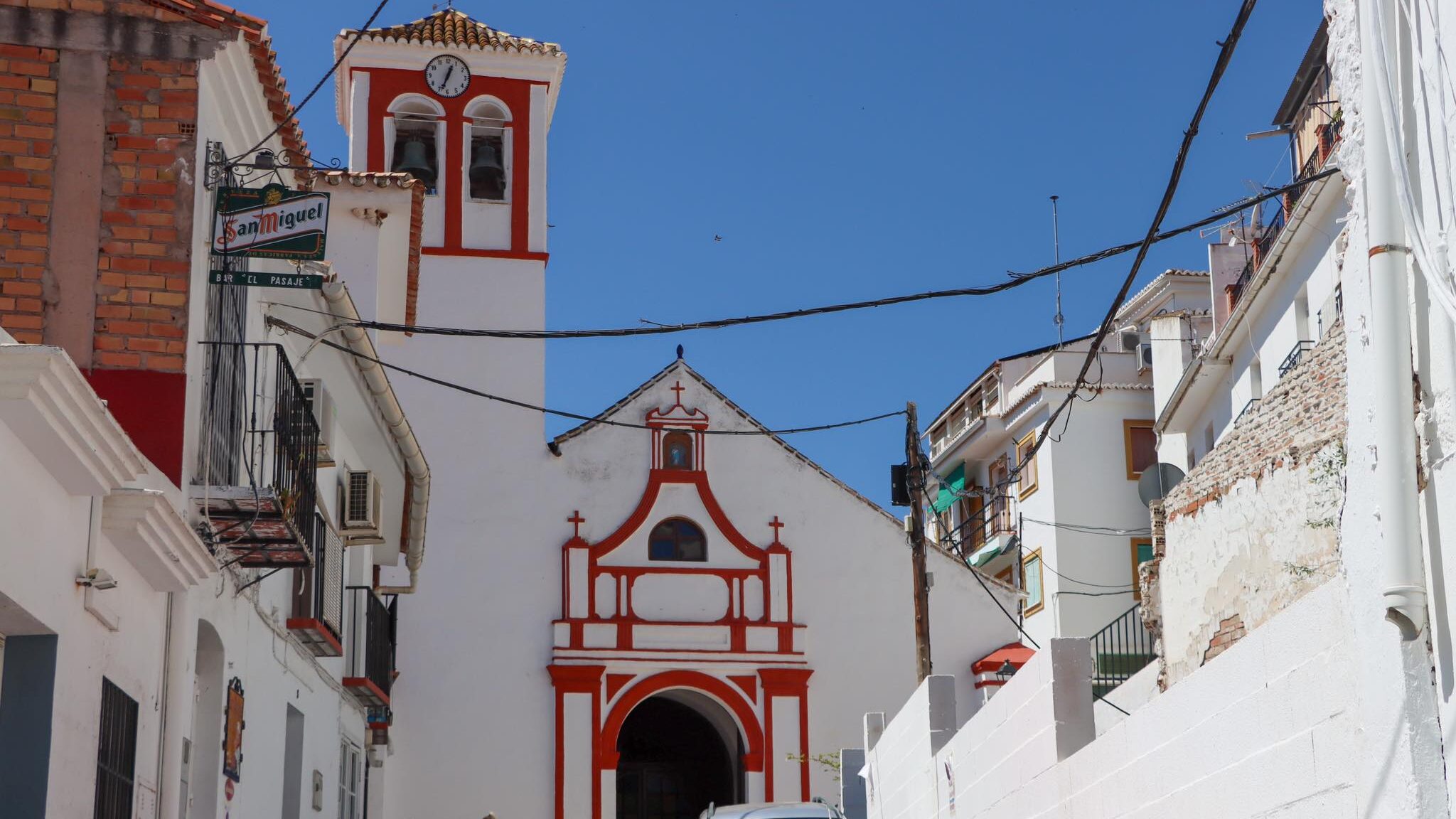 Small church in village painted white and red.