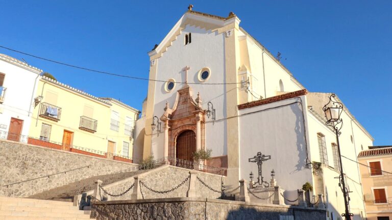 White and yellow painted church one of the top things to do in Archidona.