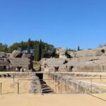 Ancient roman ruins of an amphitheatre during day trips from Seville.