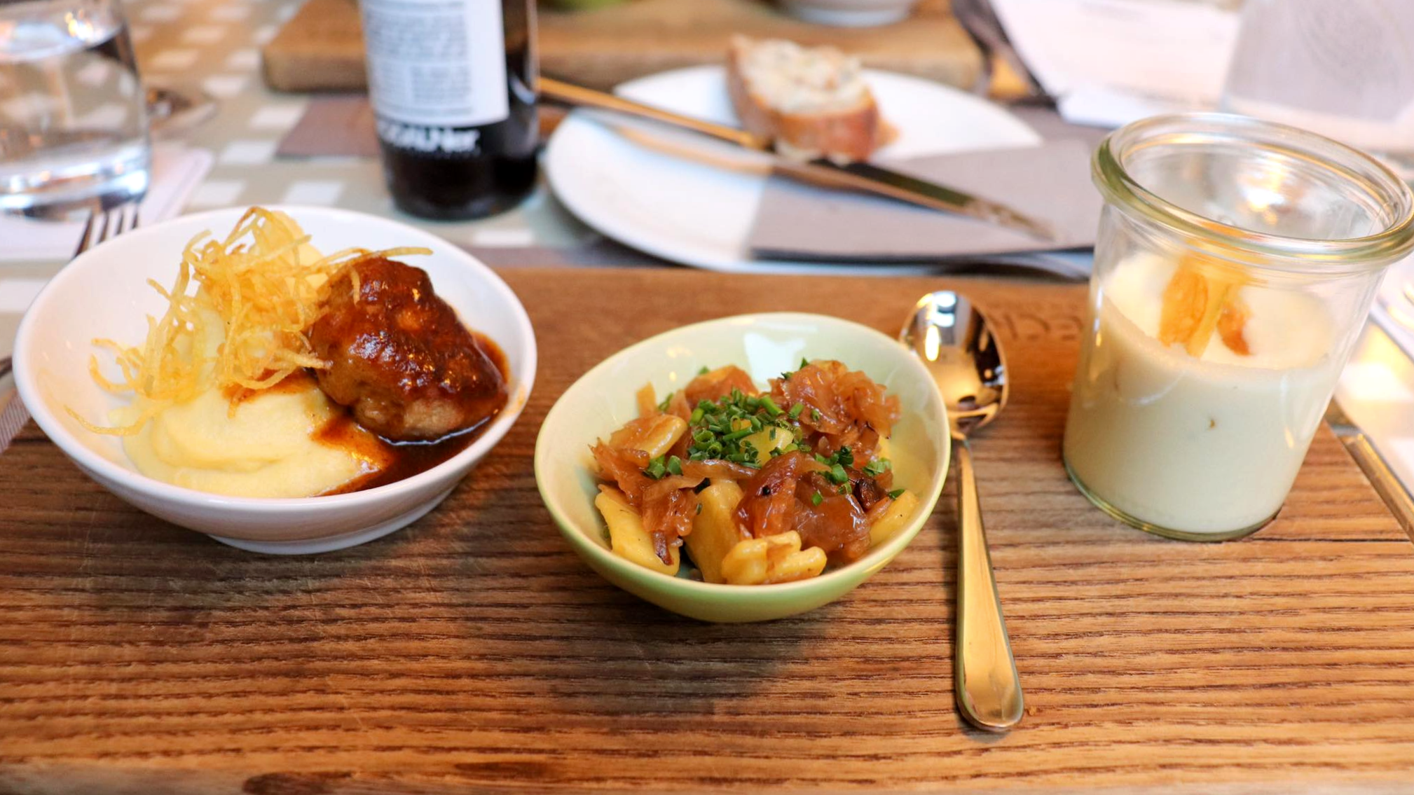 Small dishes of Austrian food on table.