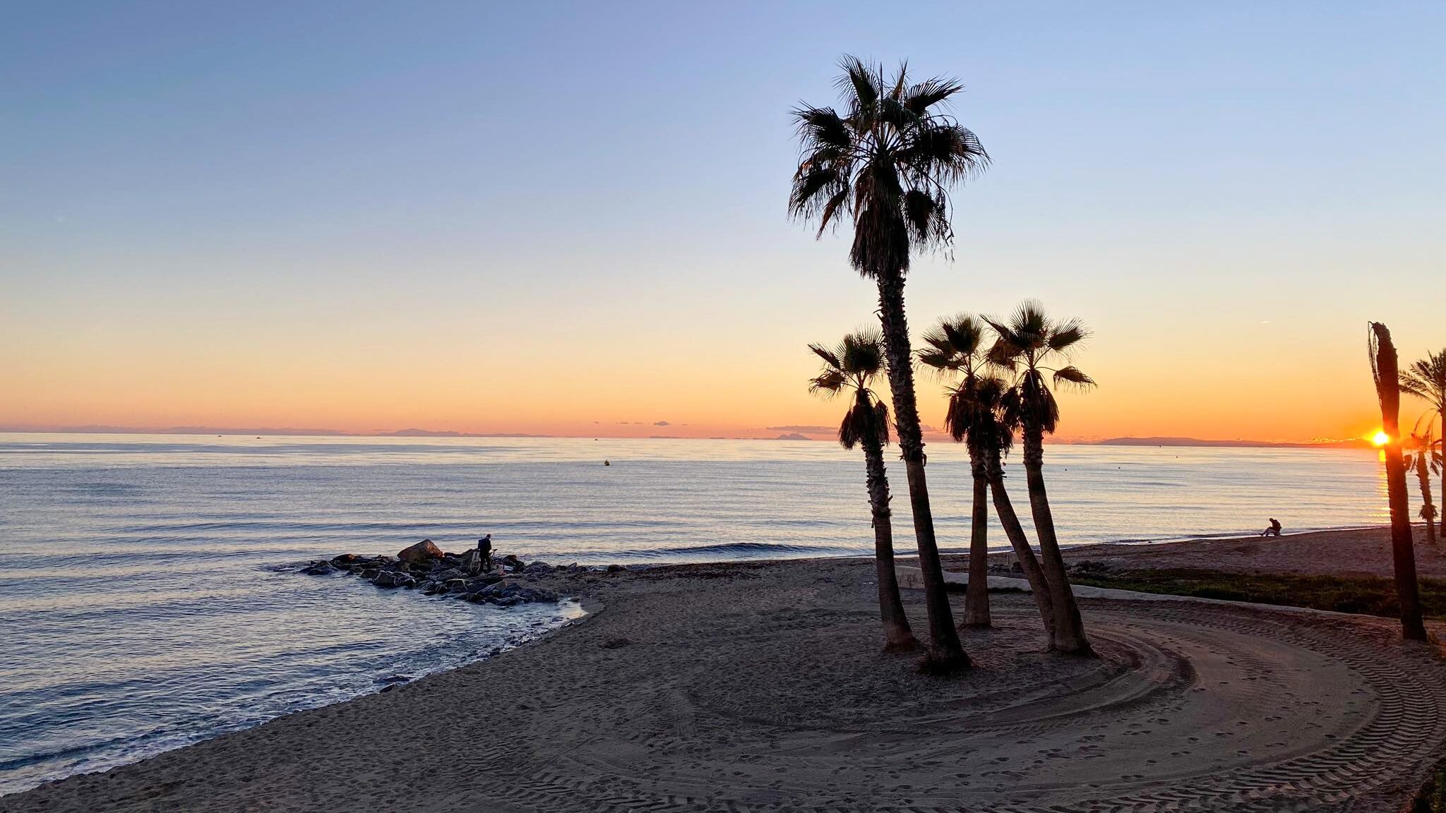 View of beach at sunset in Marbella.