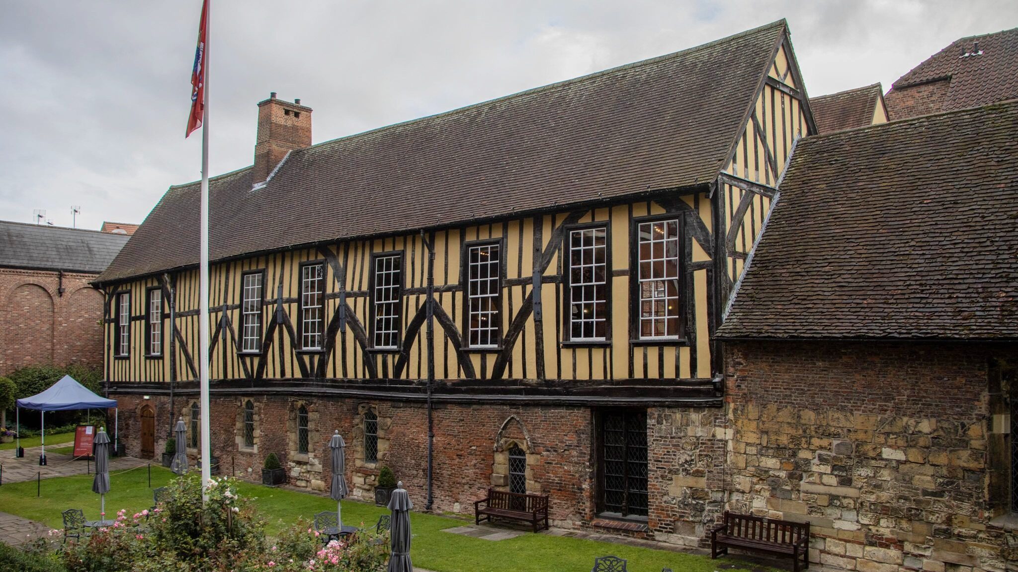 Medieval hall painted yellow with wood.