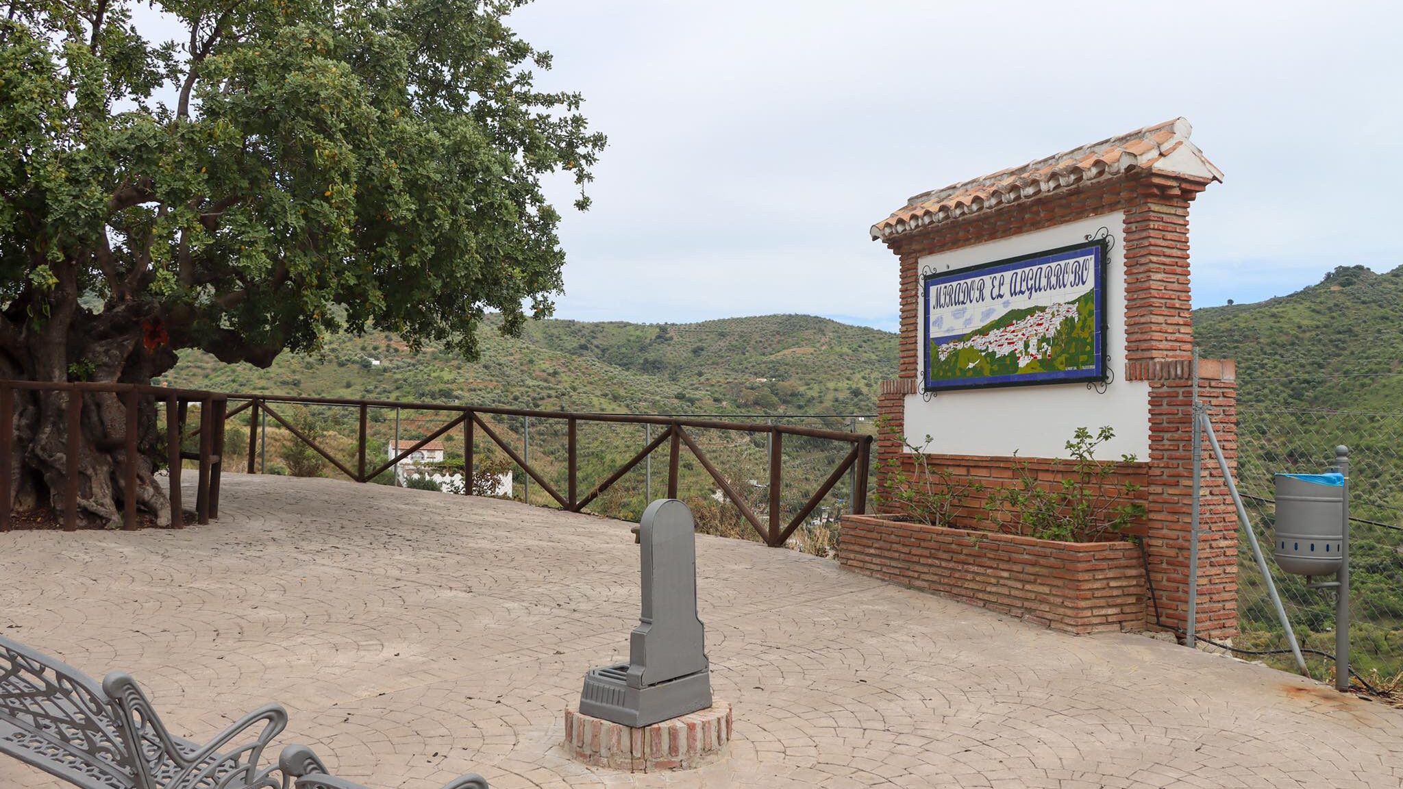 Viewpoint in white village with seating.