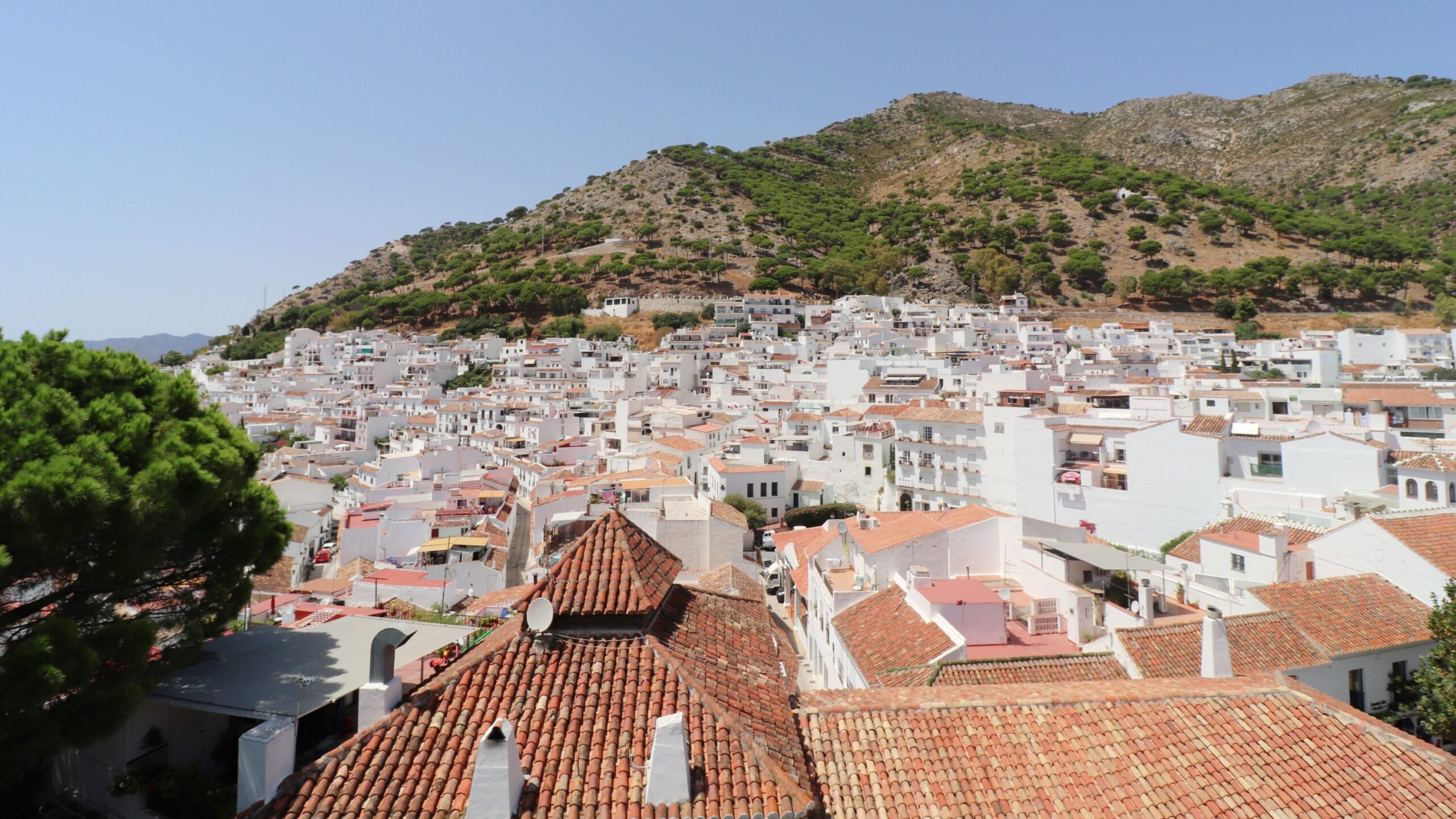 View of white village on sunny day.