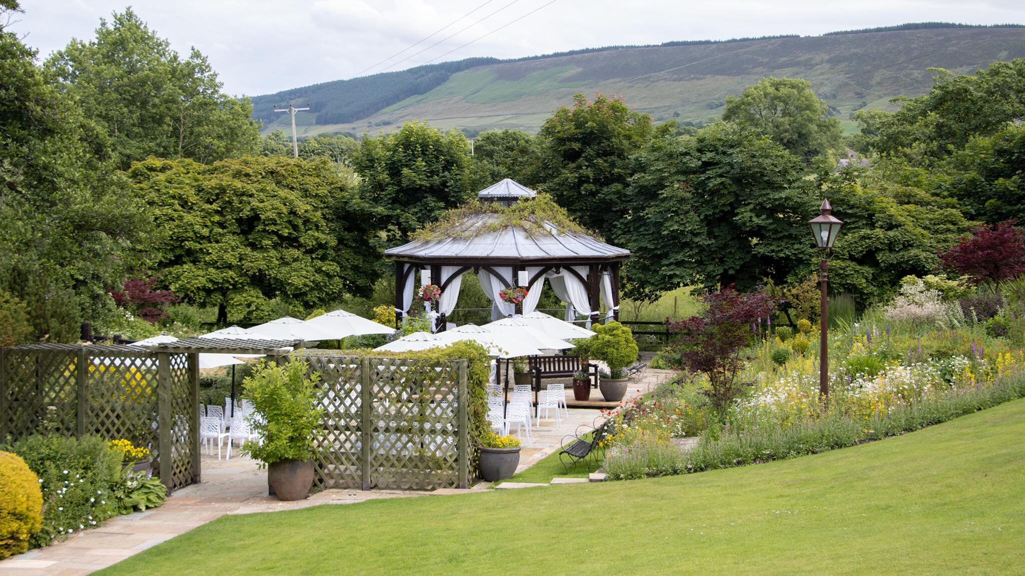 Wedding tent set up with chairs outside.