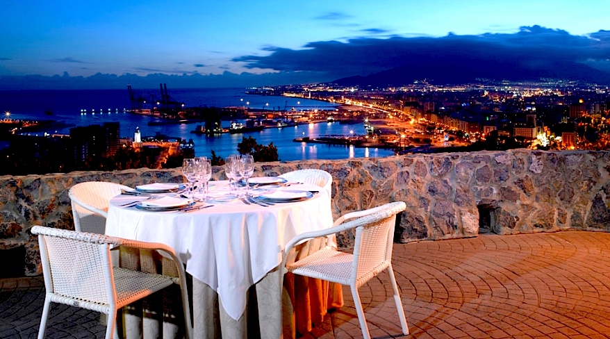 Table and chairs set up at viewpoint in Malaga.