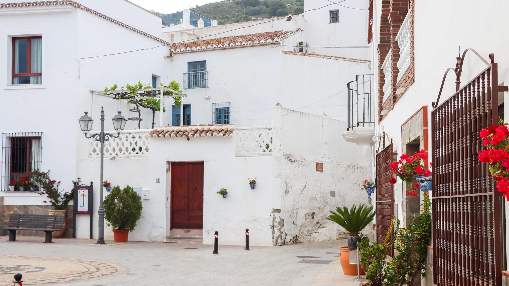 View of small square in white village.