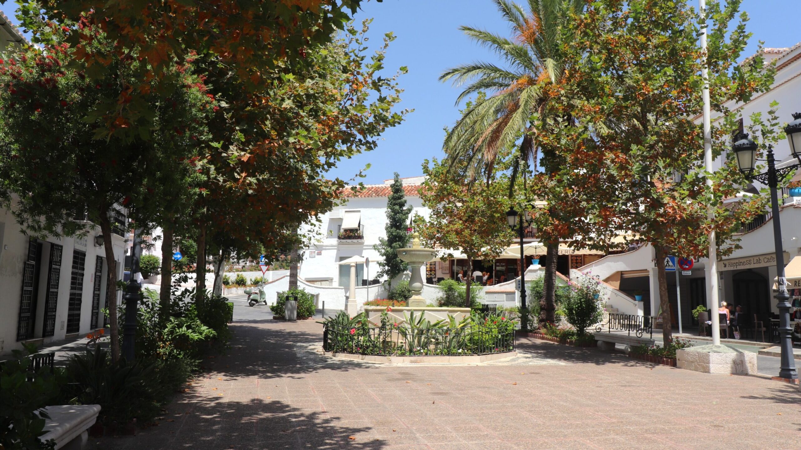 Small tree lined plaza in Mijas.