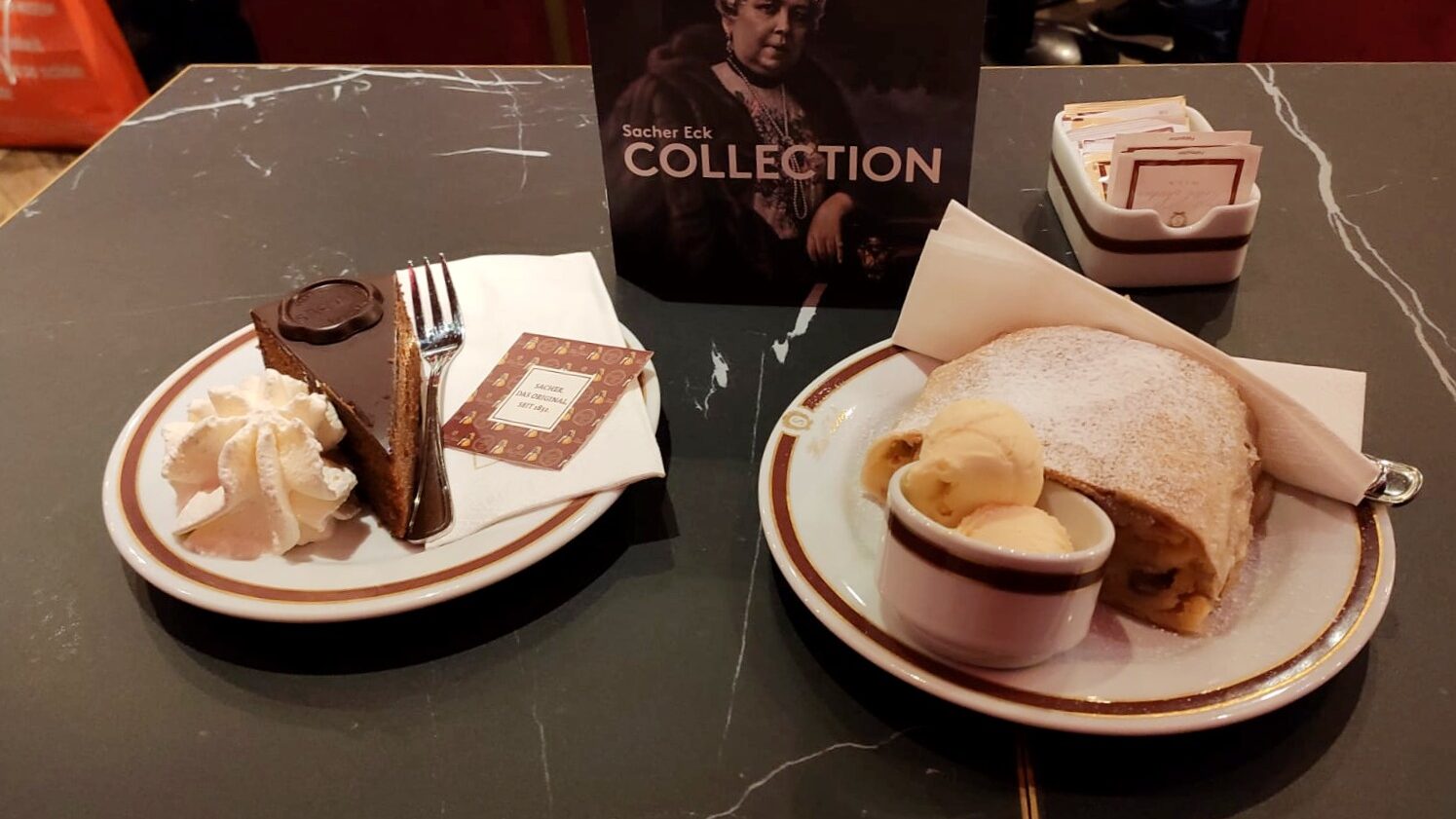 Sacher Torte and apple strudel in cafe.