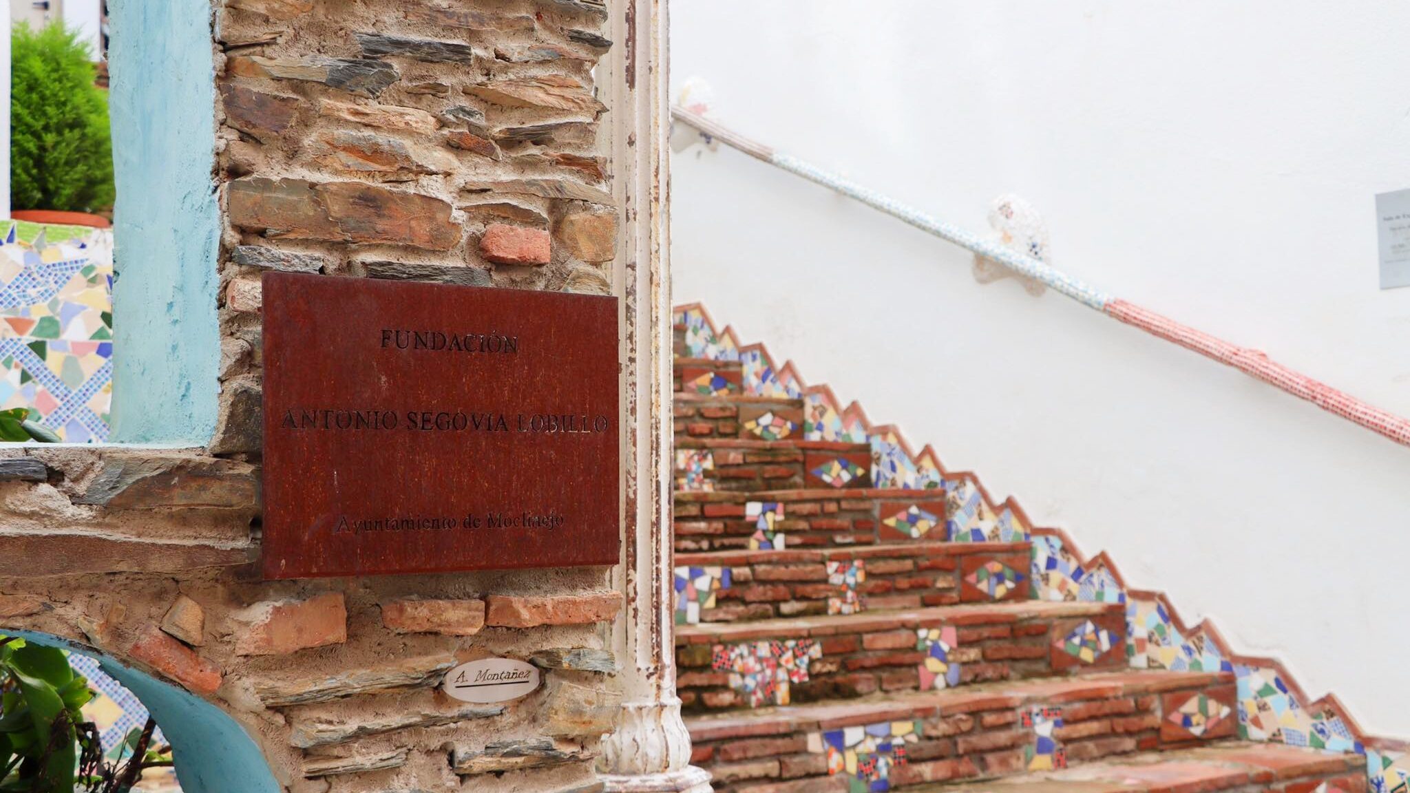 Tiled stairs leading up to doorway.