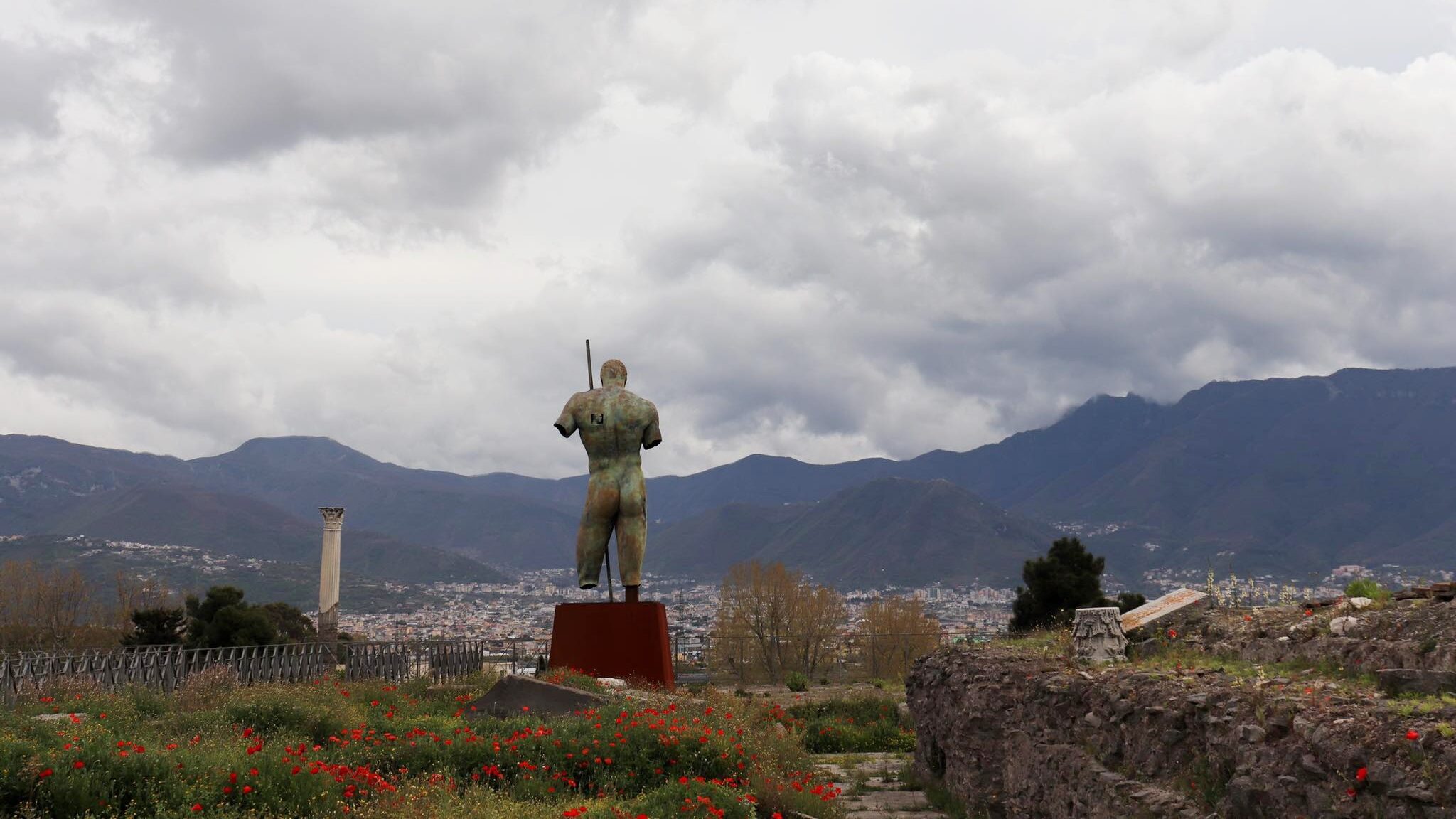 Large statue of man in Pompeii.