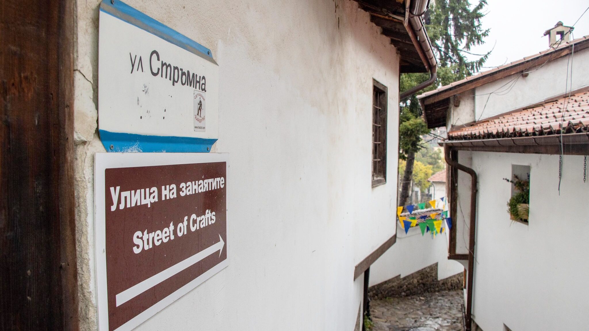 Sign leading to street of craft shops.