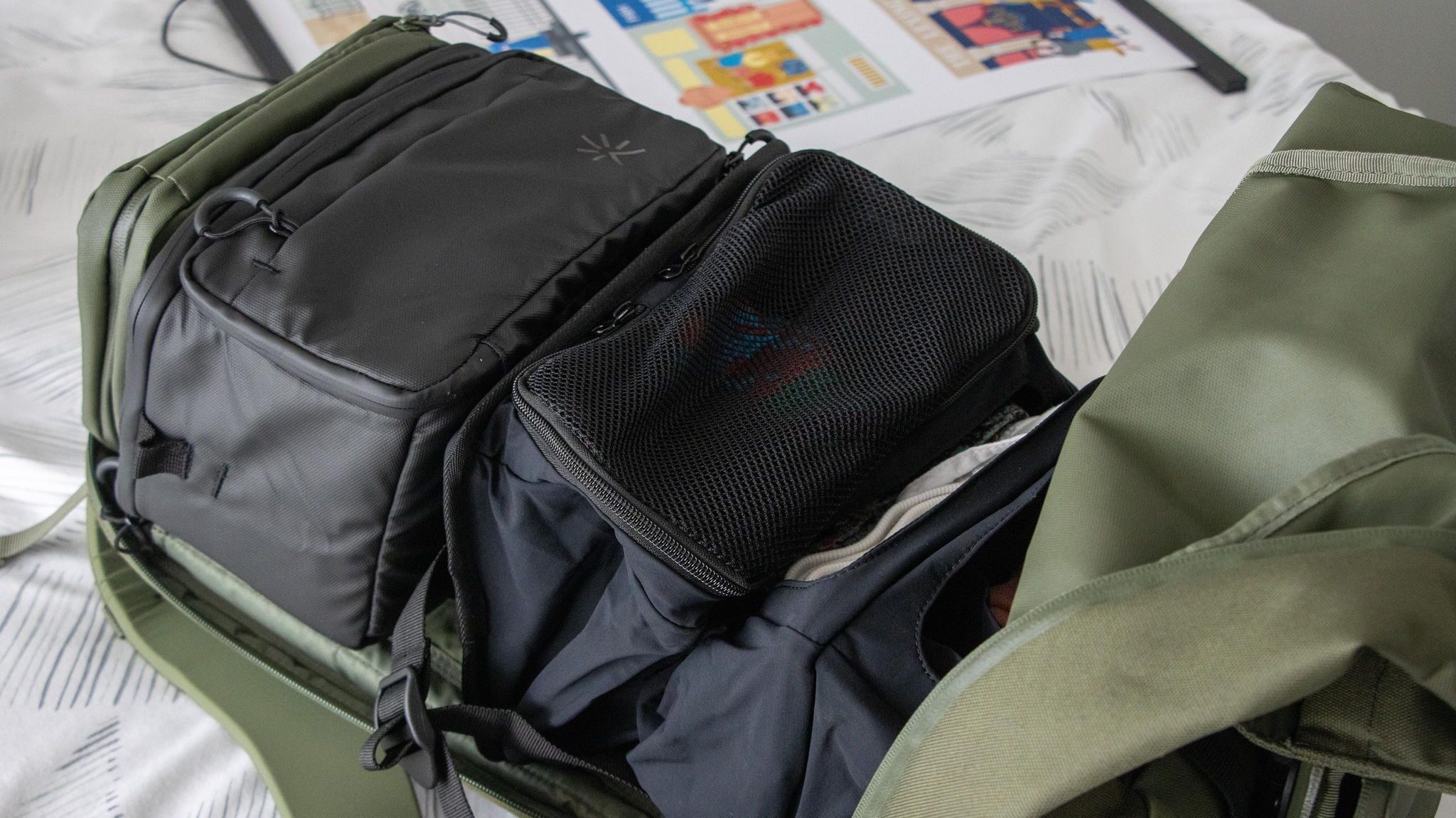 Wardrobe system sitting inside backpack.