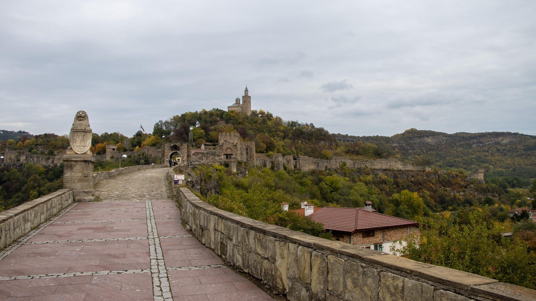 Stone bridge leading to medieval castle.