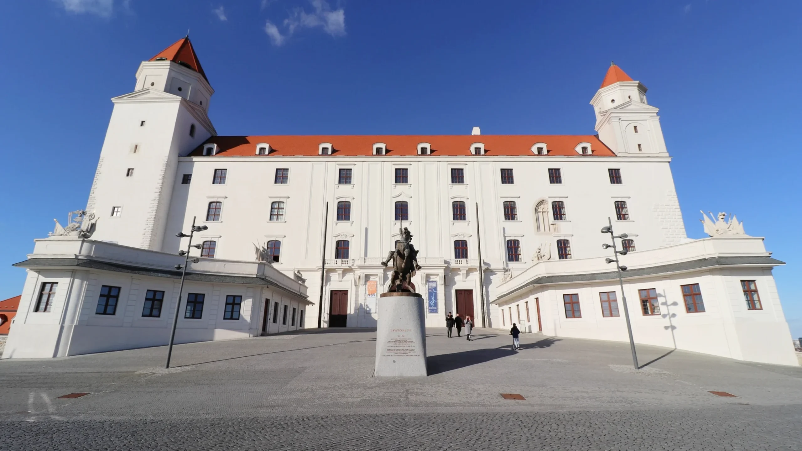 Large white castle on hill during a day in Bratislava.