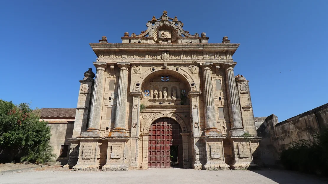 Medieval monastery with large entry gate.