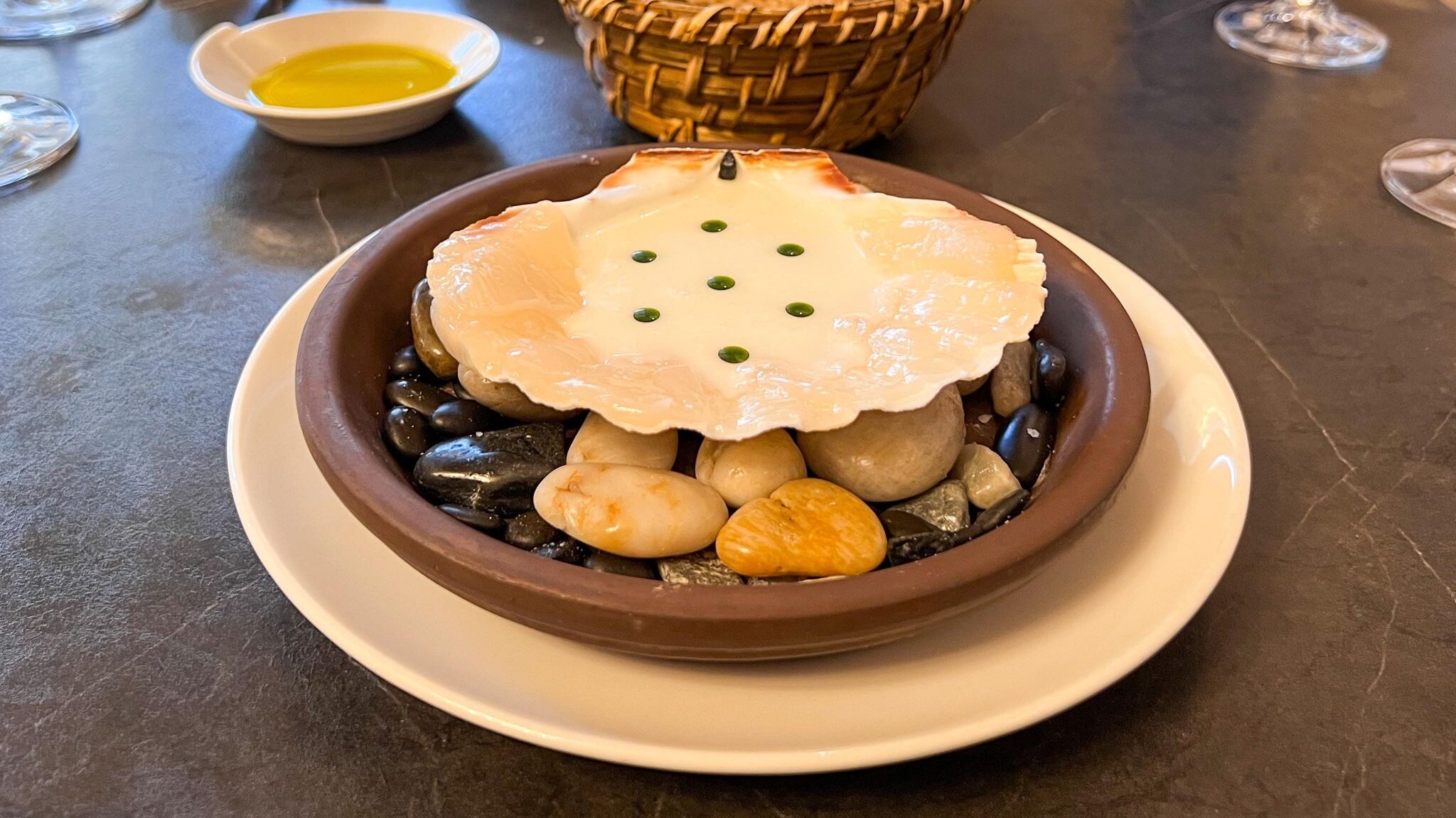 Scallops served in large shell.